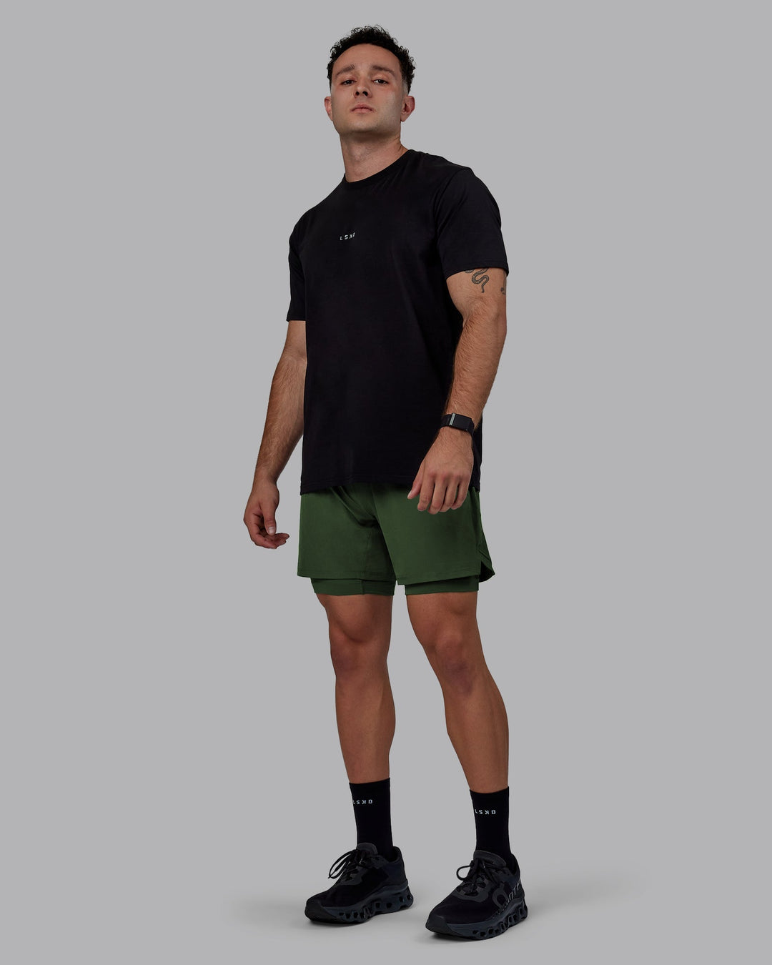 Man wearing Challenger 6" Lined Performance Shorts - Cilantro