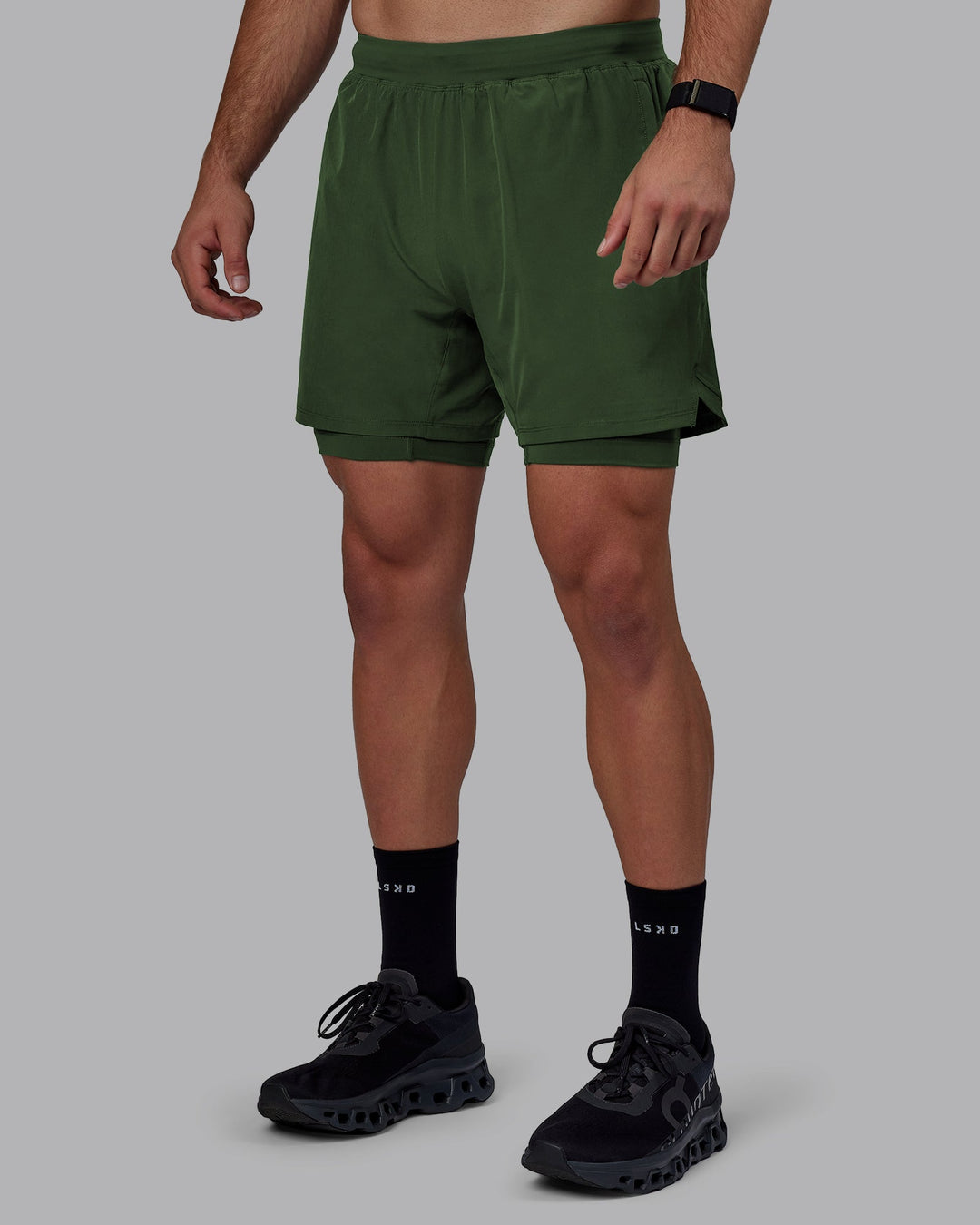 Man wearing Challenger 6" Lined Performance Shorts - Cilantro