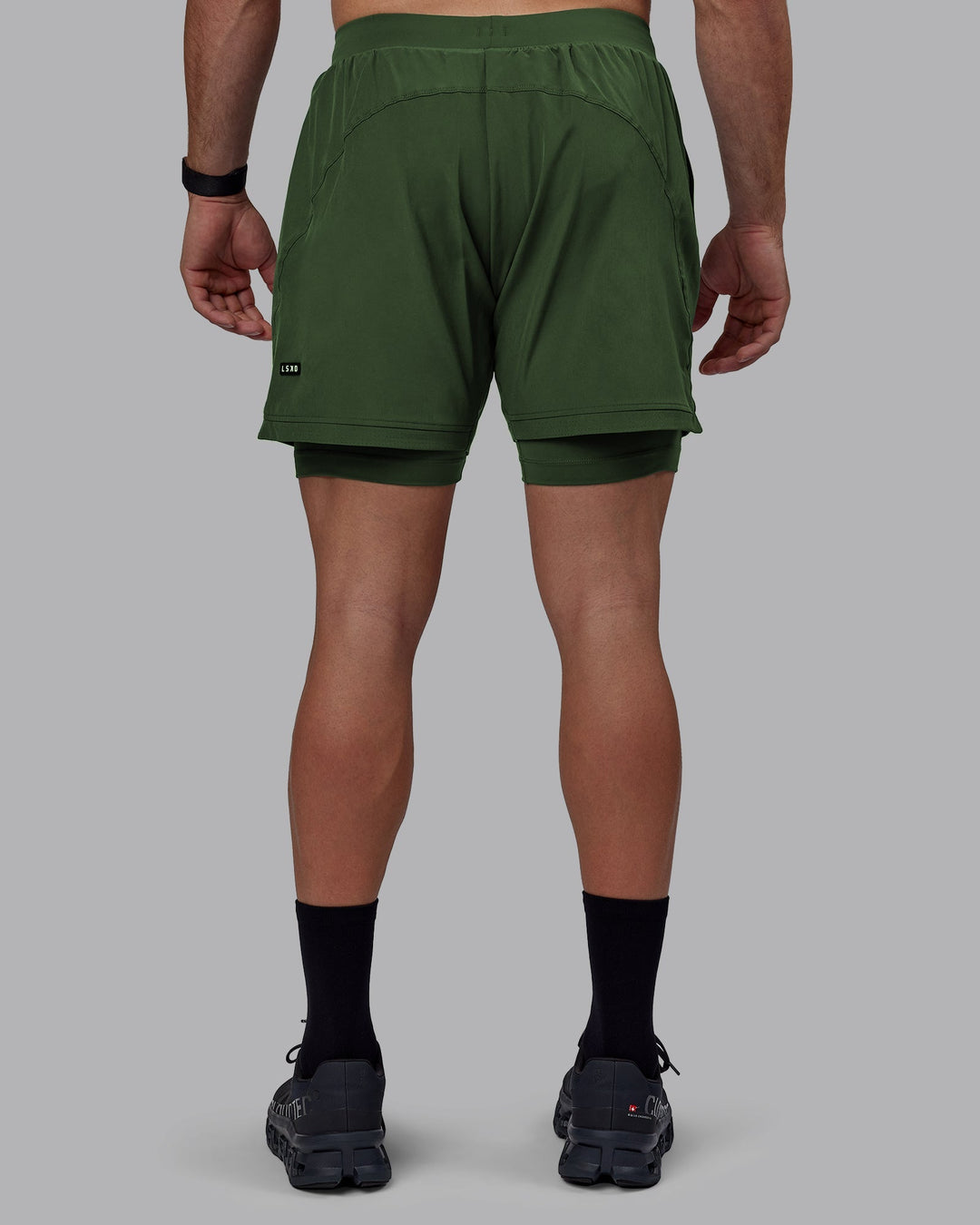 Man wearing Challenger 6" Lined Performance Shorts - Cilantro