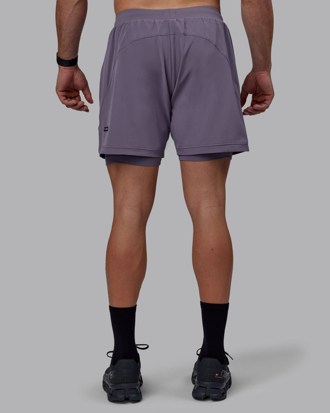 Man wearing Challenger 6" Lined Performance Shorts - Purple Sage