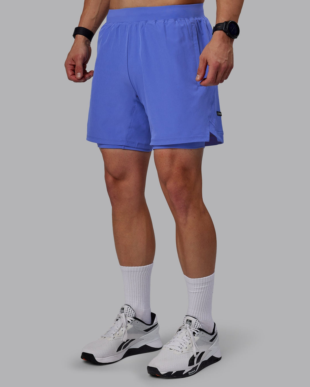 Man wearing Challenger 6" Lined Performance Shorts - Baja Blue