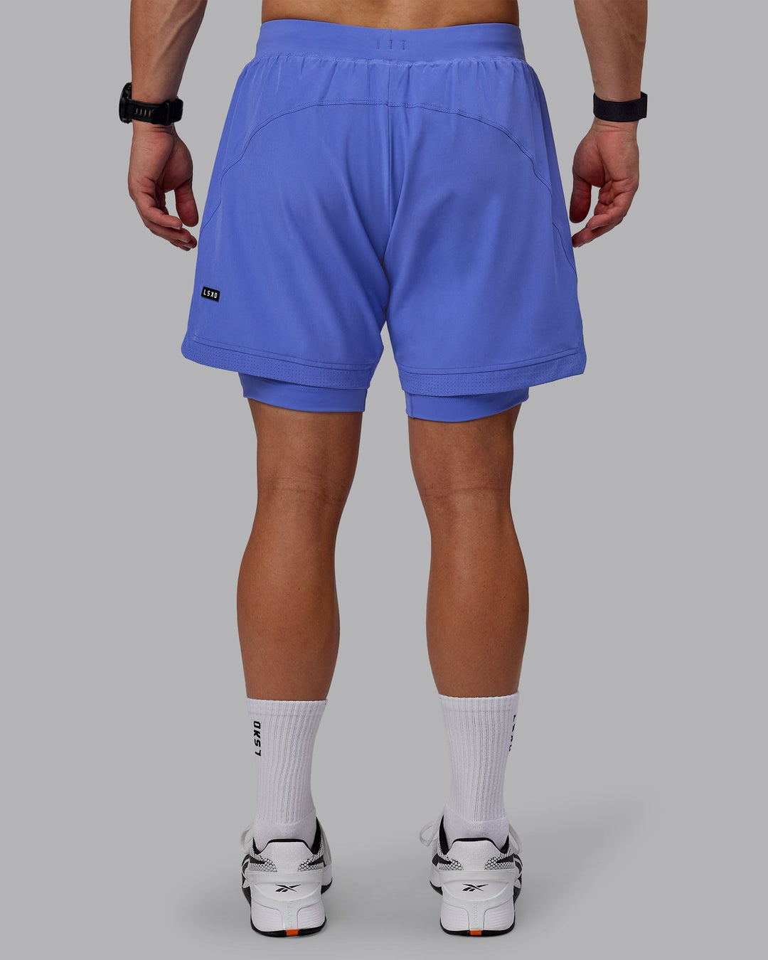 Man wearing Challenger 6" Lined Performance Shorts - Baja Blue