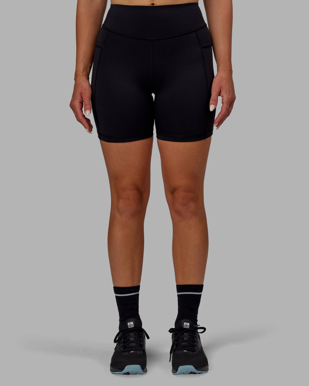 Woman wearing Elite High-Rise 6" Short Pockets - Black
