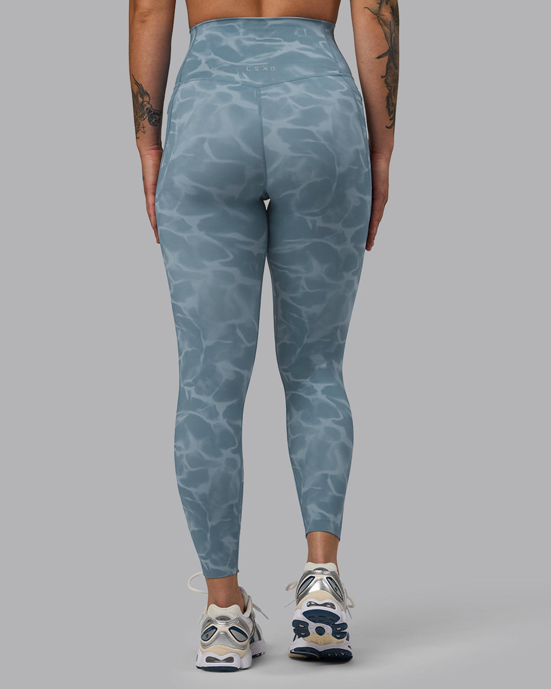Woman wearing Elixir Ultra High-Rise 7/8 Legging Pockets - Tranquil-Elemental Blue