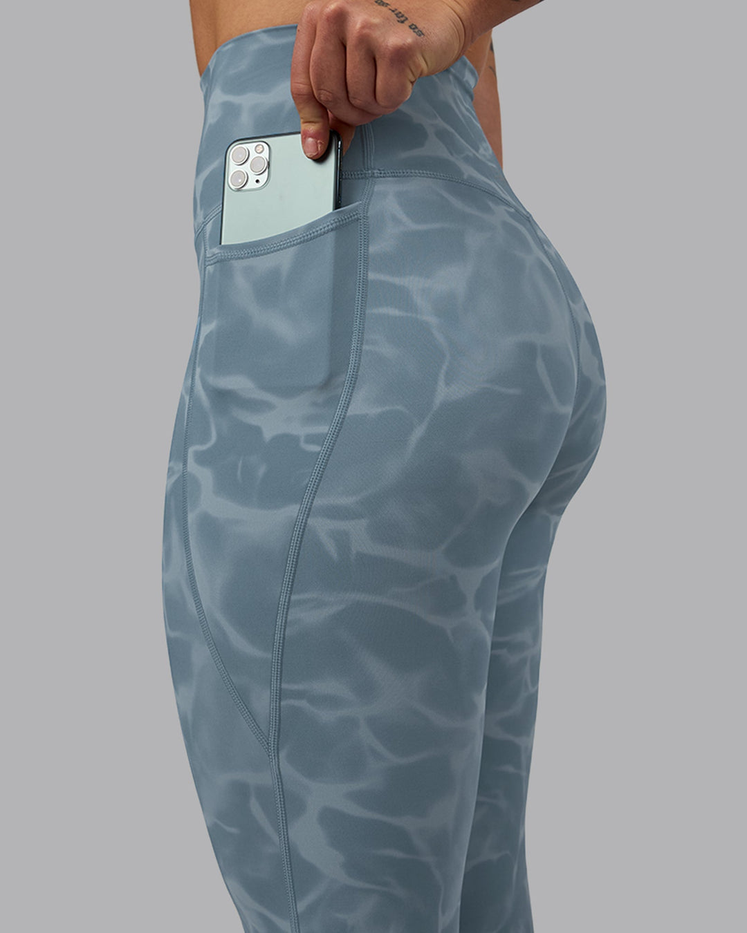 Woman wearing Elixir Ultra High-Rise 7/8 Legging Pockets - Tranquil-Elemental Blue