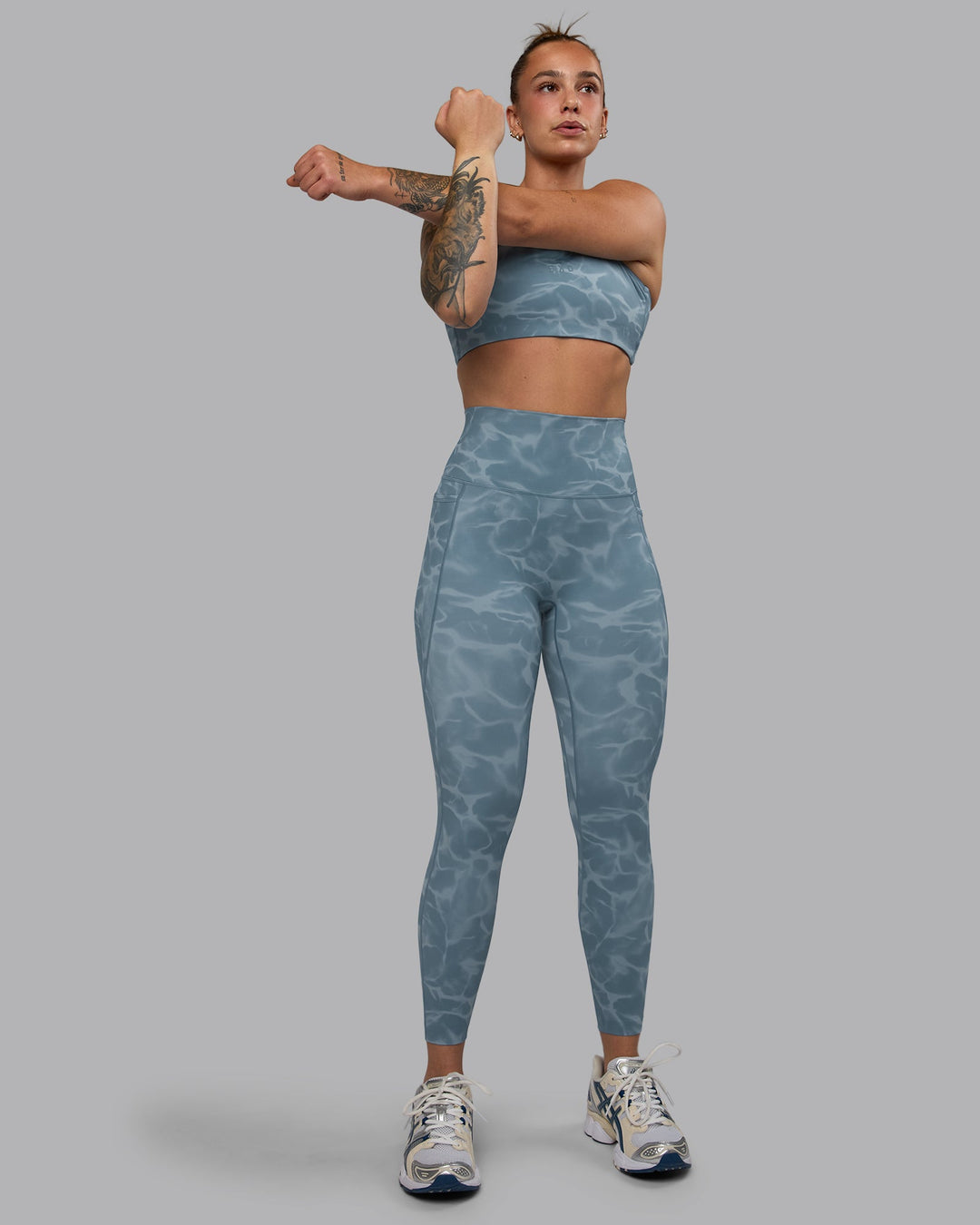 Woman wearing Elixir Ultra High-Rise 7/8 Legging Pockets - Tranquil-Elemental Blue