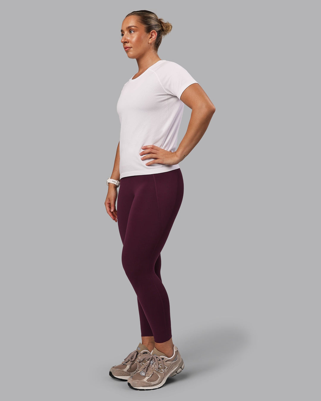 Woman wearing Elixir Ultra High-Rise 7/8 Legging Pockets - Cherry Lacquer