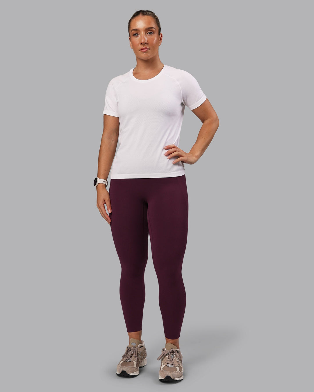 Woman wearing Elixir Ultra High-Rise 7/8 Legging Pockets - Cherry Lacquer