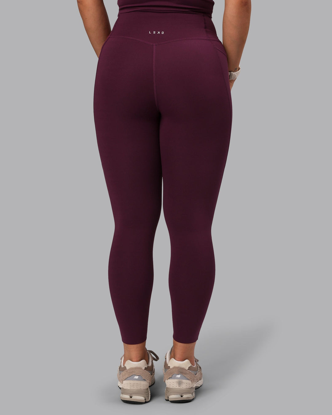 Woman wearing Elixir Ultra High-Rise 7/8 Legging Pockets - Cherry Lacquer
