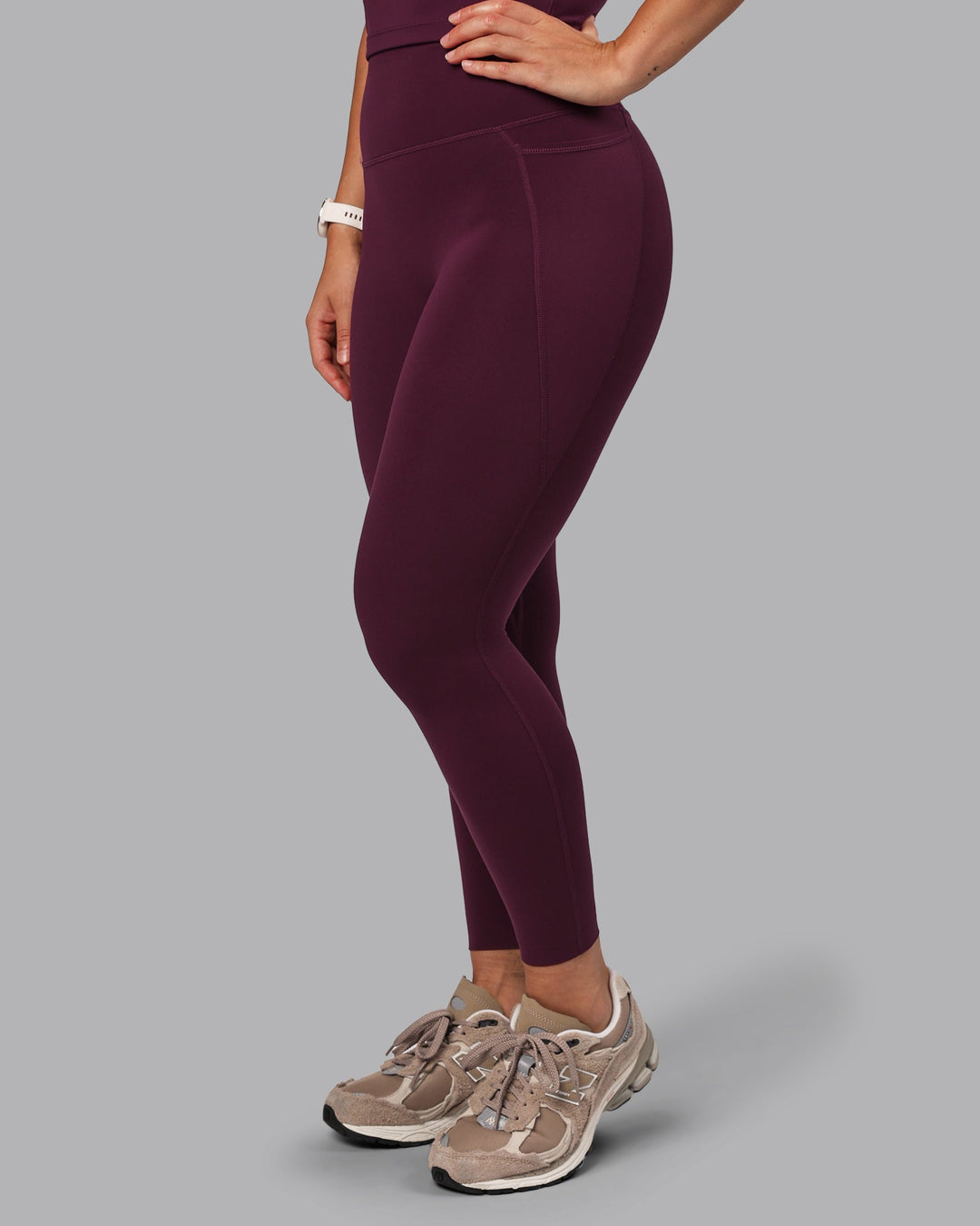 Woman wearing Elixir Ultra High-Rise 7/8 Legging Pockets - Cherry Lacquer