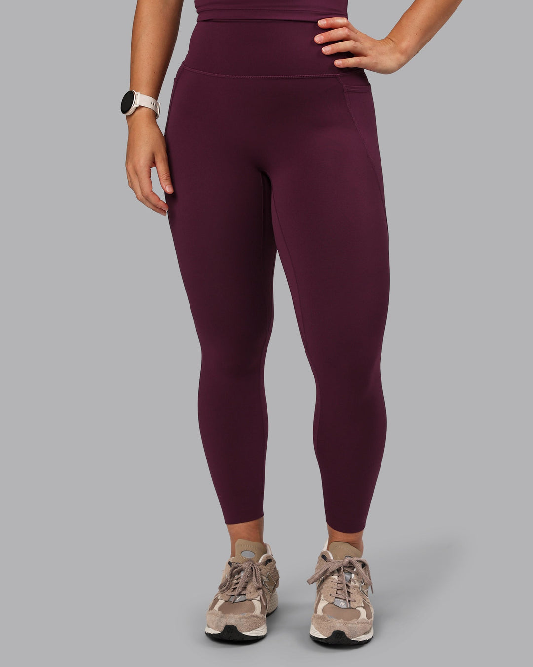 Woman wearing Elixir Ultra High-Rise 7/8 Legging Pockets - Cherry Lacquer