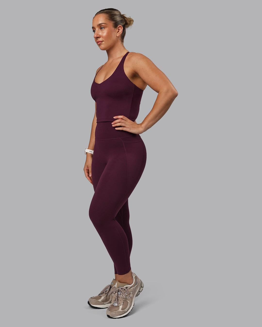 Woman wearing Elixir Ultra High-Rise 7/8 Legging Pockets - Cherry Lacquer