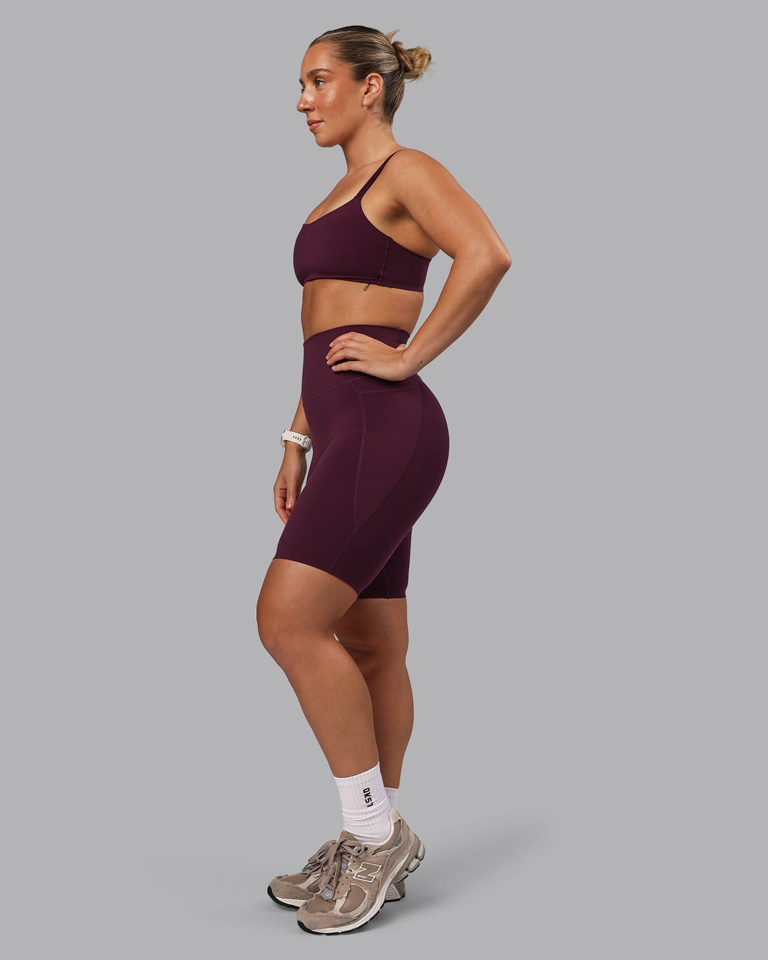 Woman wearing Elixir Ultra High-Rise 9" Short Pockets - Cherry Lacquer