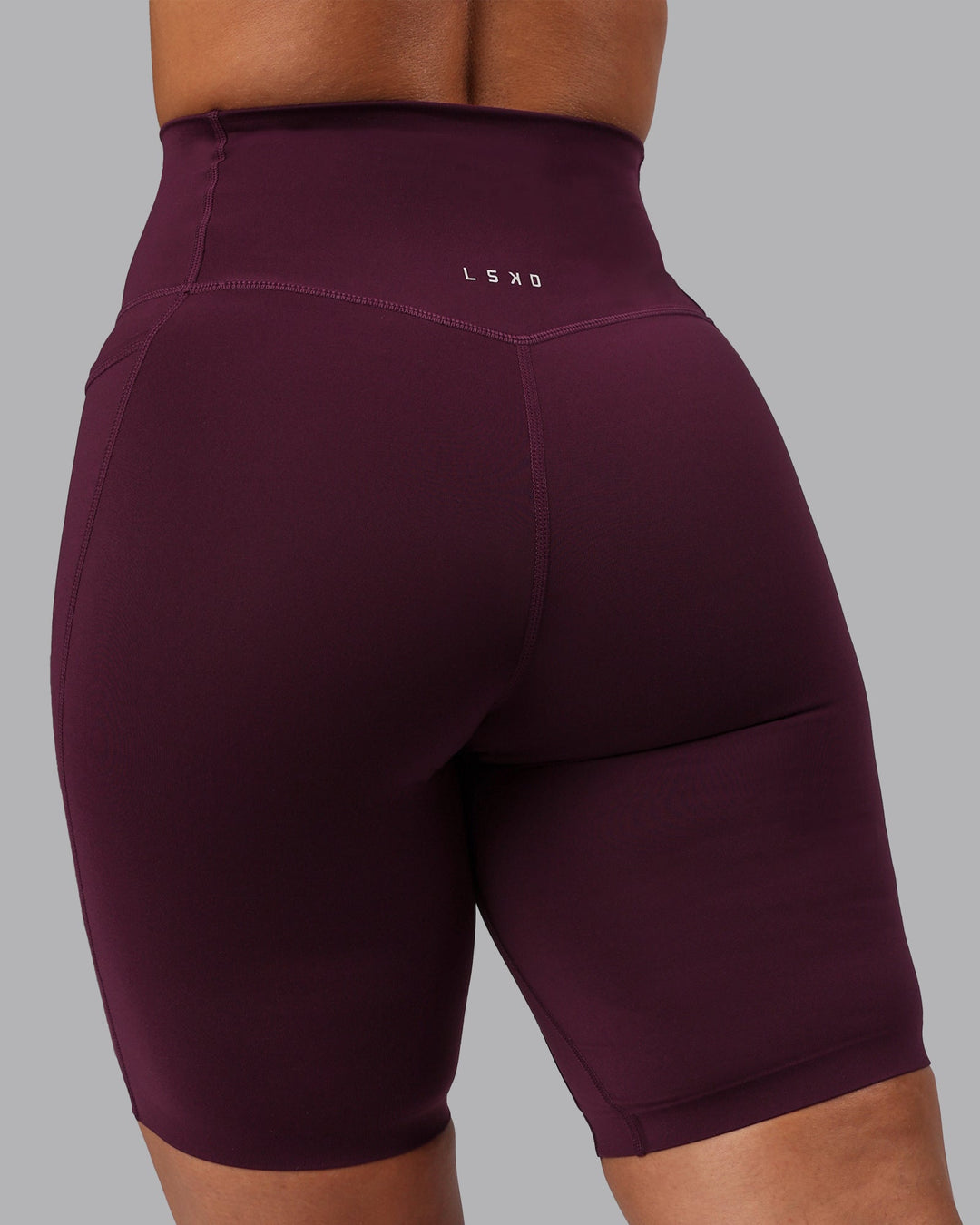 Woman wearing Elixir Ultra High-Rise 9" Short Pockets - Cherry Lacquer