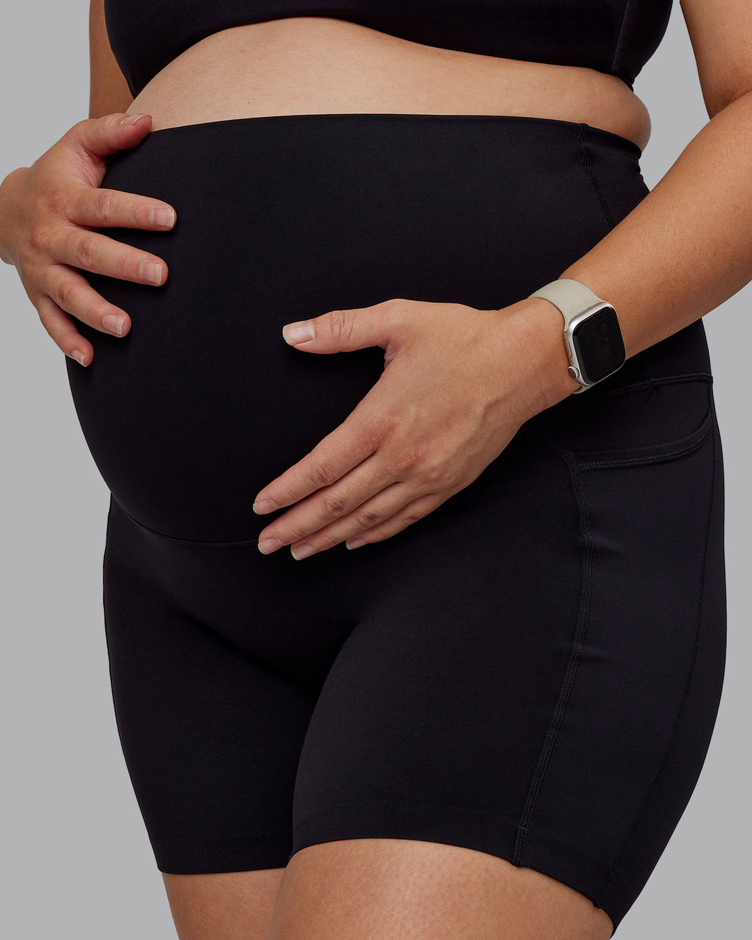 Woman wearing Elixir Ultra High-Rise Maternity 6" Short Pockets - Black | Model:Nevada | Size:M
