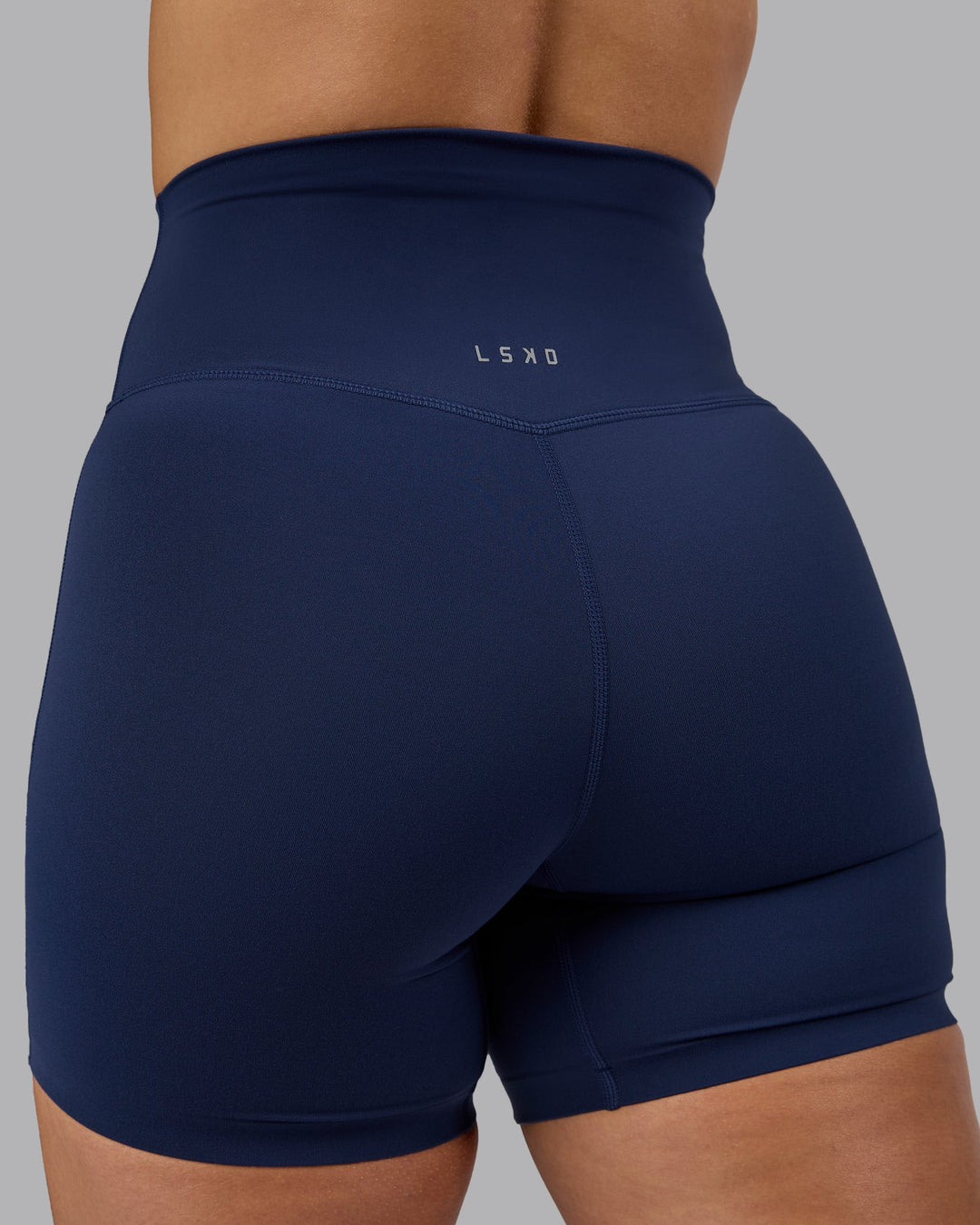 Woman wearing Elixir Ultra High-Rise 6" Short - Future Navy