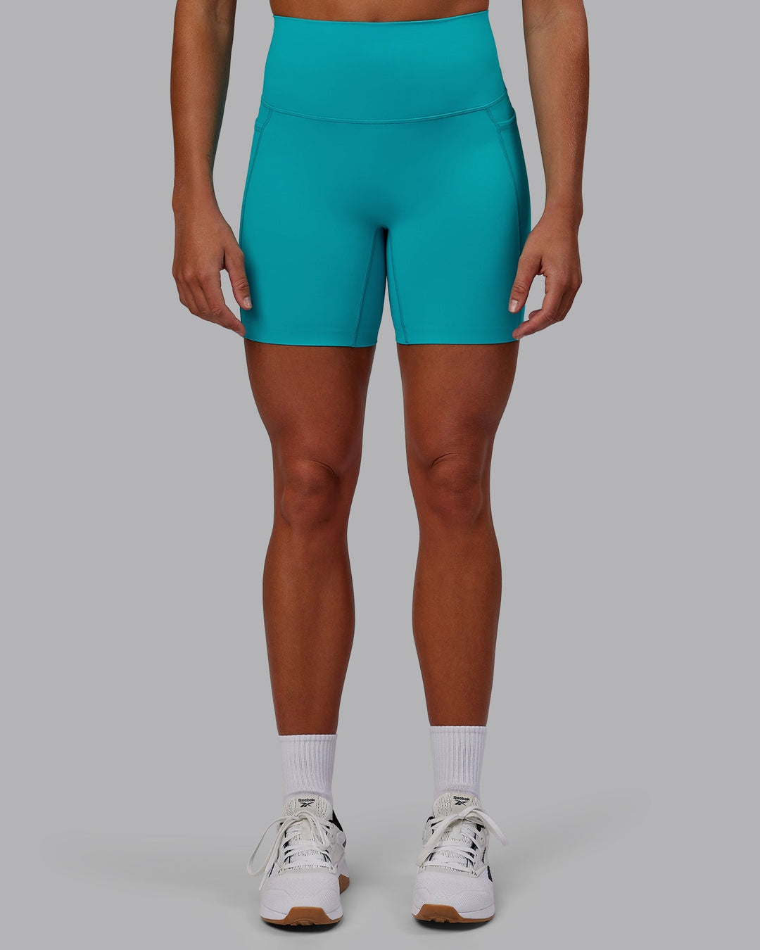 Woman wearing Elixir Ultra High-Rise 6" Short Pockets - Blue Bird