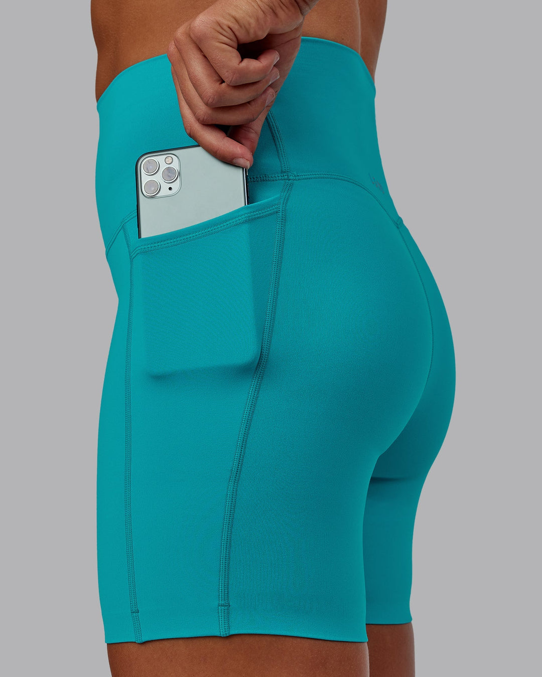 Woman wearing Elixir Ultra High-Rise 6" Short Pockets - Blue Bird