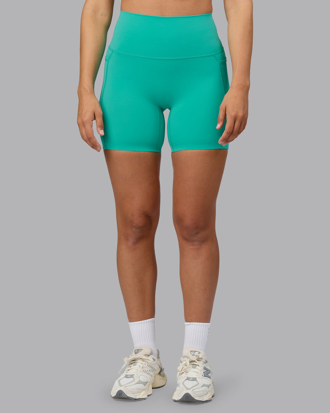Woman wearing Elixir Ultra High-Rise 6" Short Pockets - Atlantis