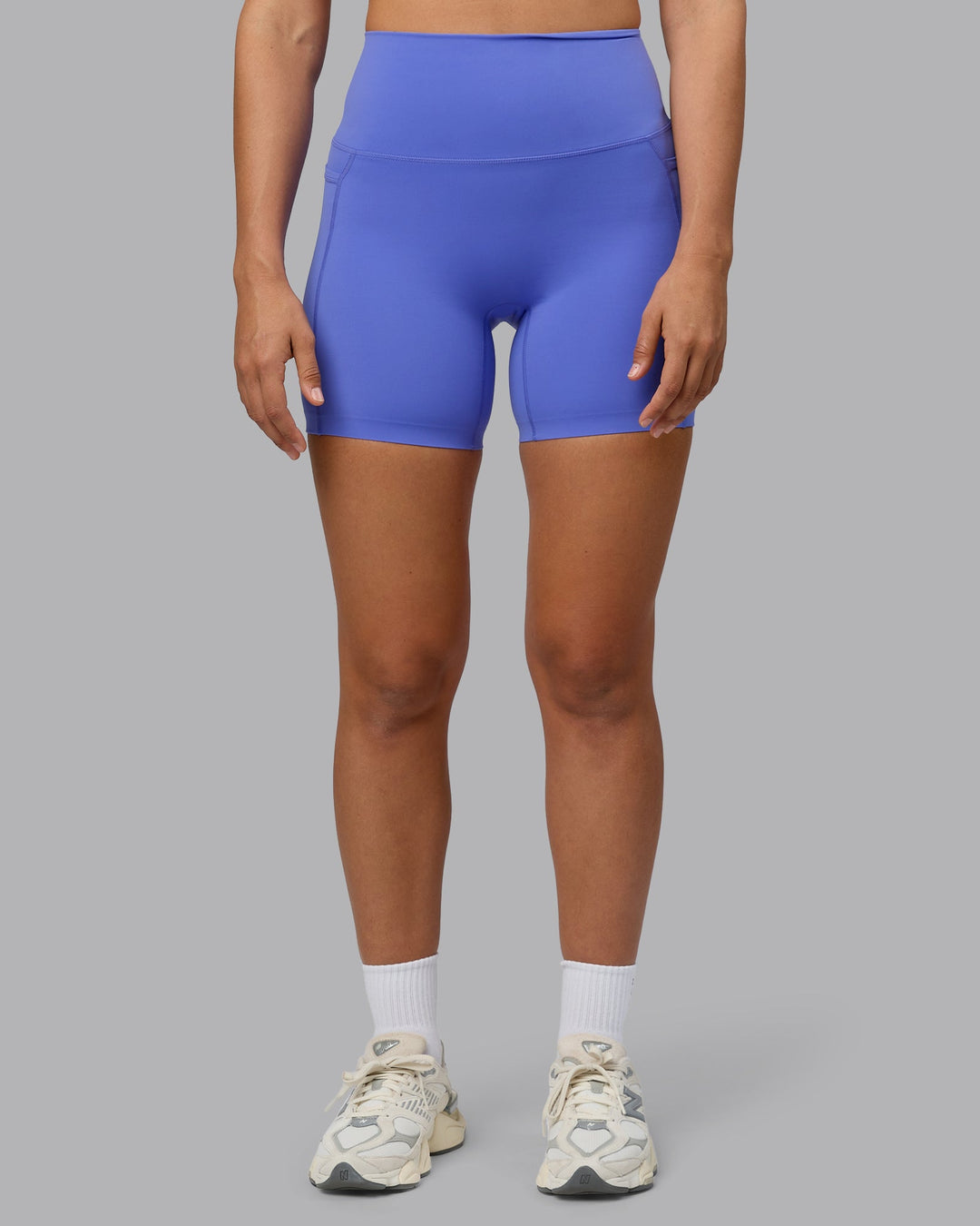 Woman wearing Elixir Ultra High-Rise 6" Short Pockets - Baja Blue