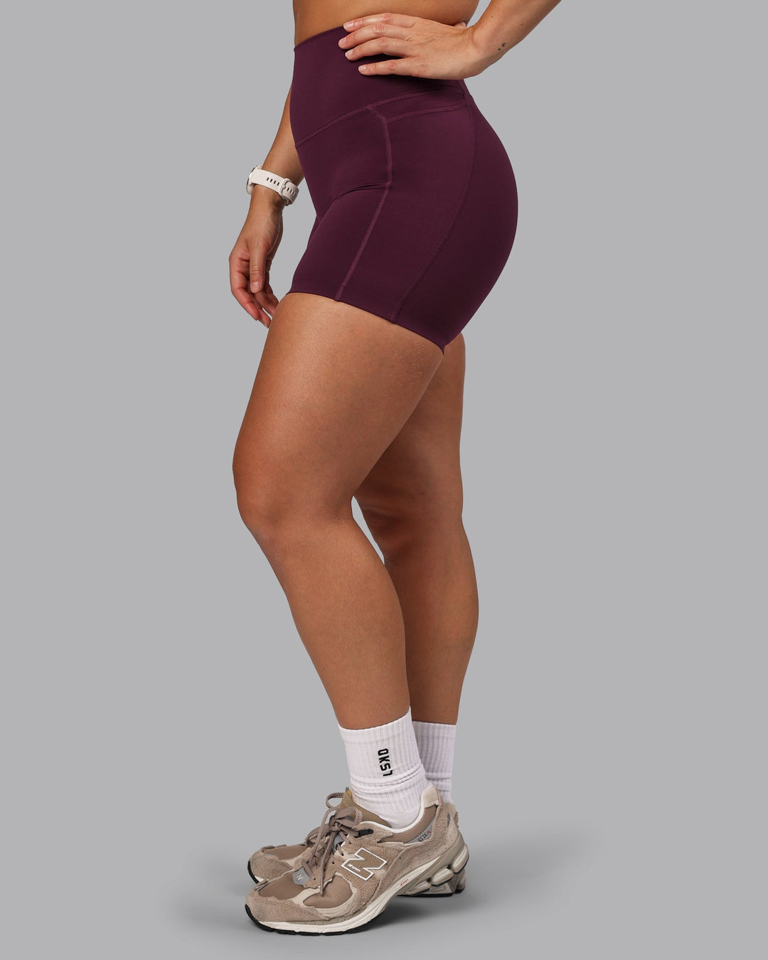 Woman wearing Elixir Ultra High-Rise 6" Short Pockets - Cherry Lacquer