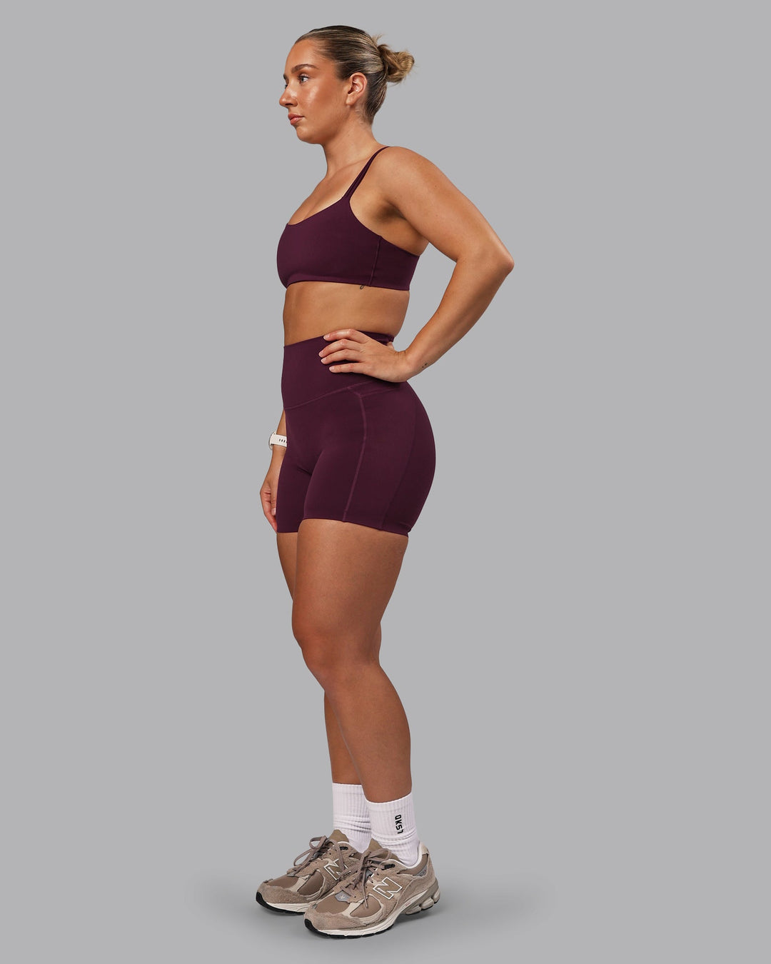 Woman wearing Elixir Ultra High-Rise 6" Short Pockets - Cherry Lacquer