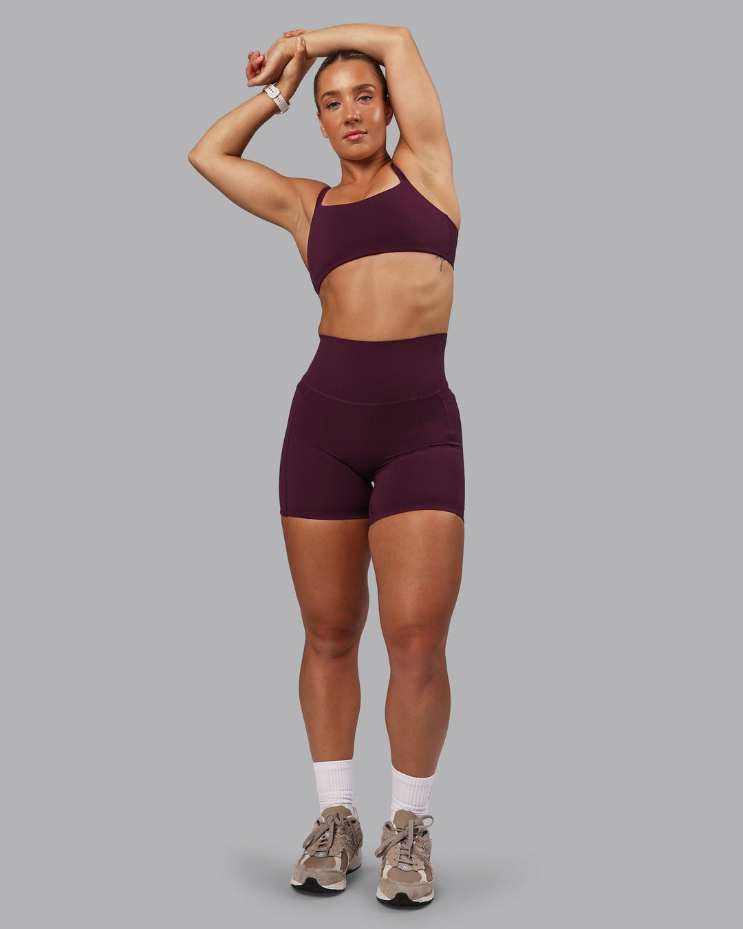 Woman wearing Elixir Ultra High-Rise 6" Short Pockets - Cherry Lacquer