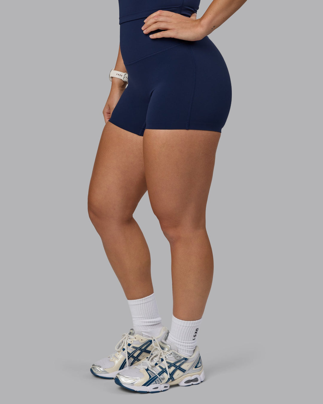 Woman wearing Elixir Ultra High-Rise 4" Short - Future Navy