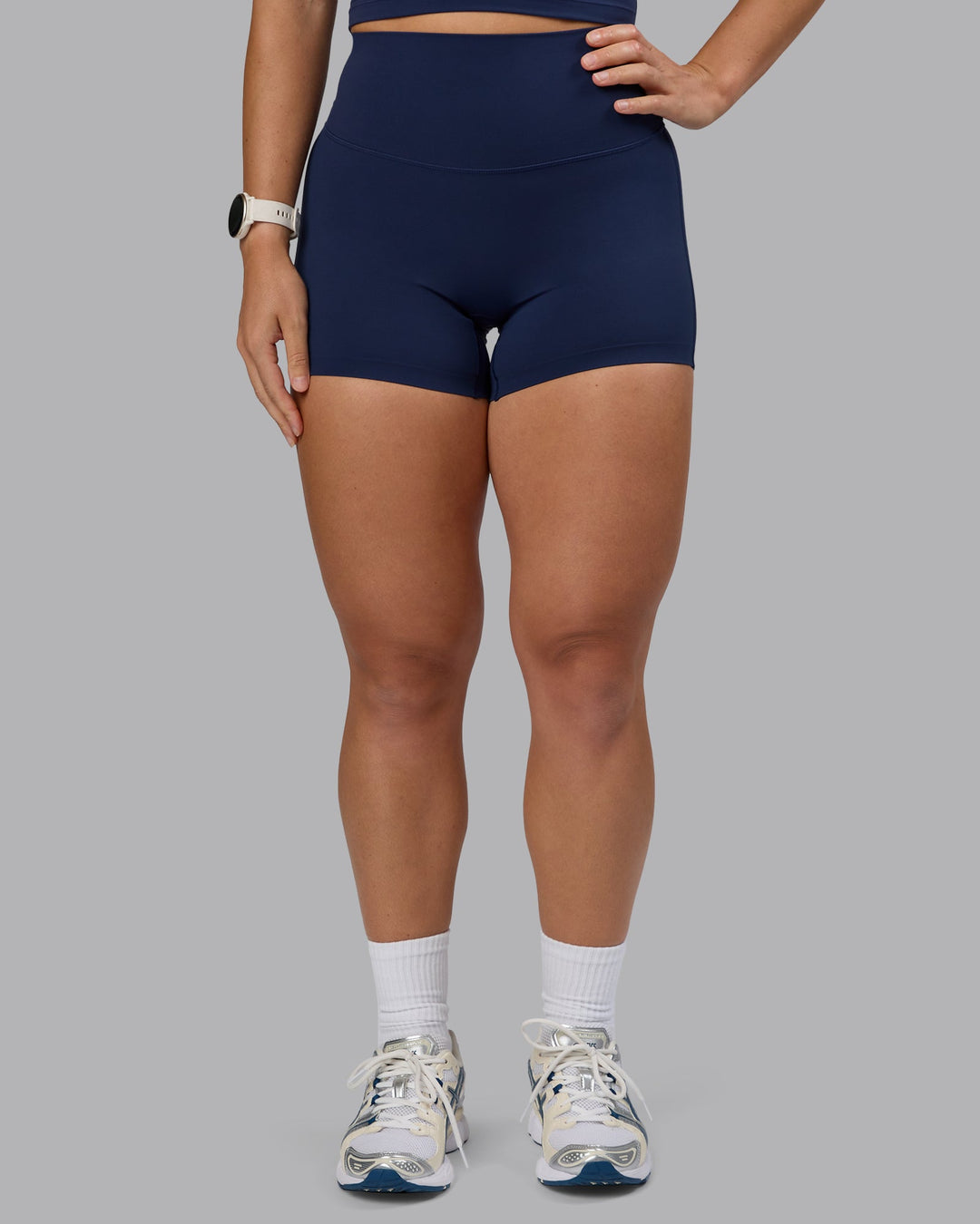 Woman wearing Elixir Ultra High-Rise 4" Short - Future Navy