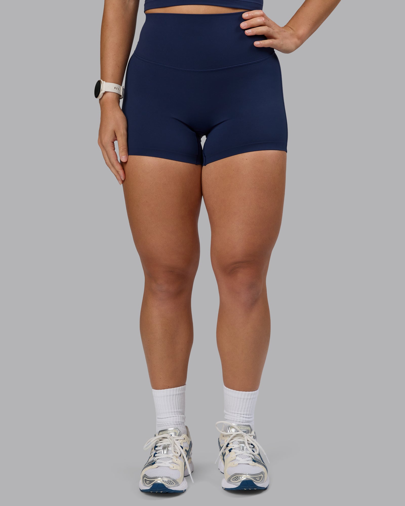 Woman wearing Elixir Ultra High-Rise 4" Short - Future Navy
