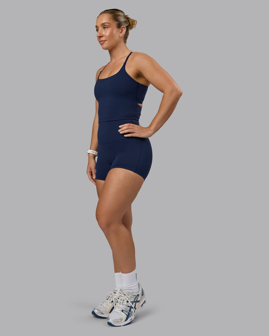 Woman wearing Elixir Ultra High-Rise 4" Short - Future Navy