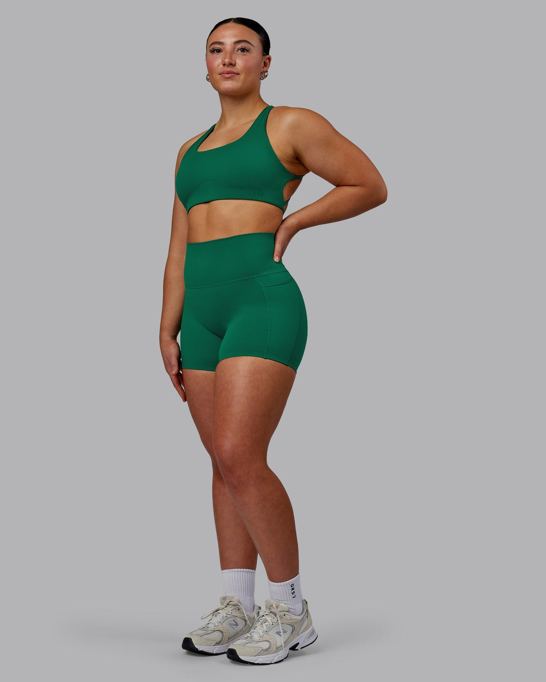 Woman wearing Elixir Ultra High-Rise 4" Short Pockets - Malachite