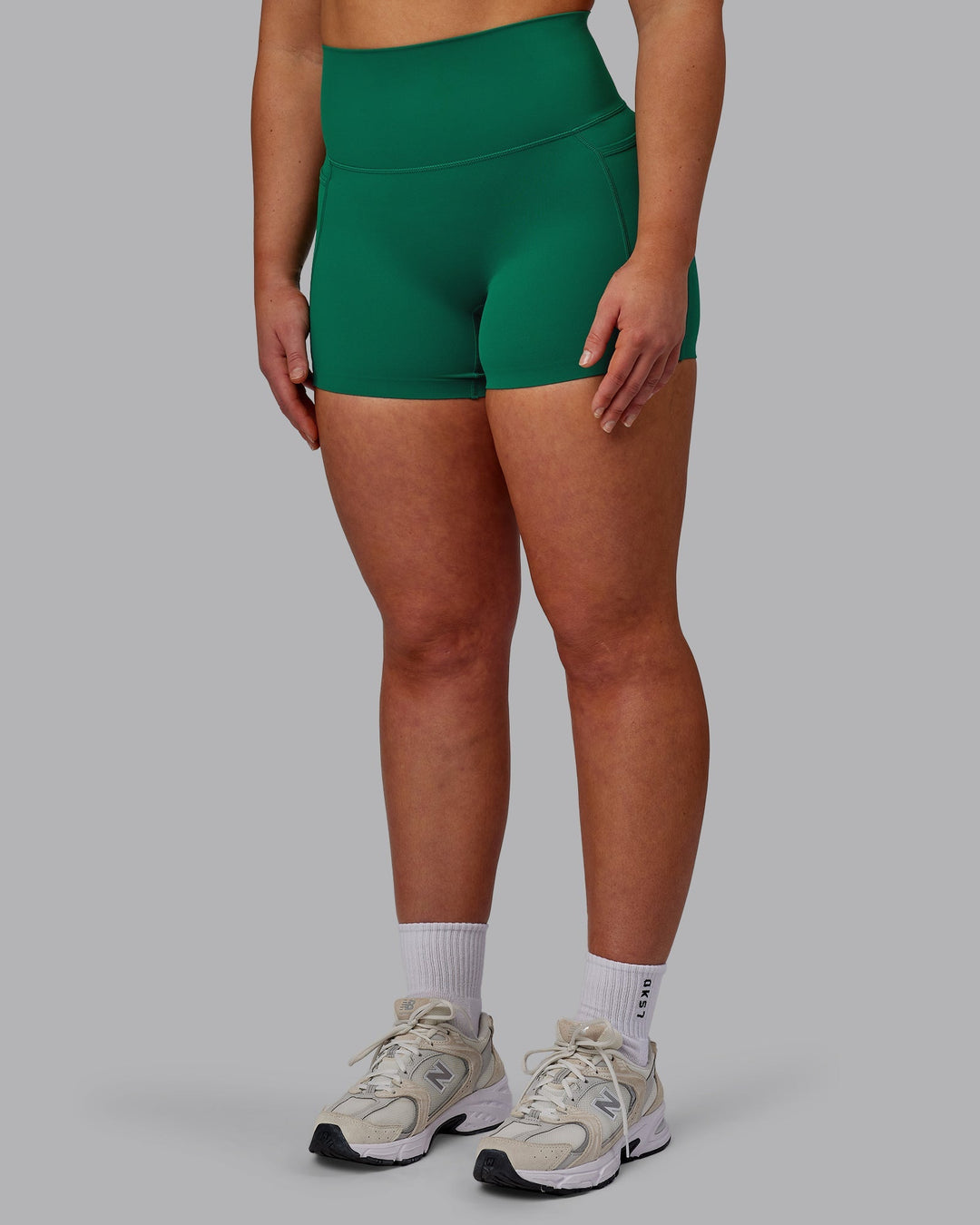 Woman wearing Elixir Ultra High-Rise 4" Short Pockets - Malachite