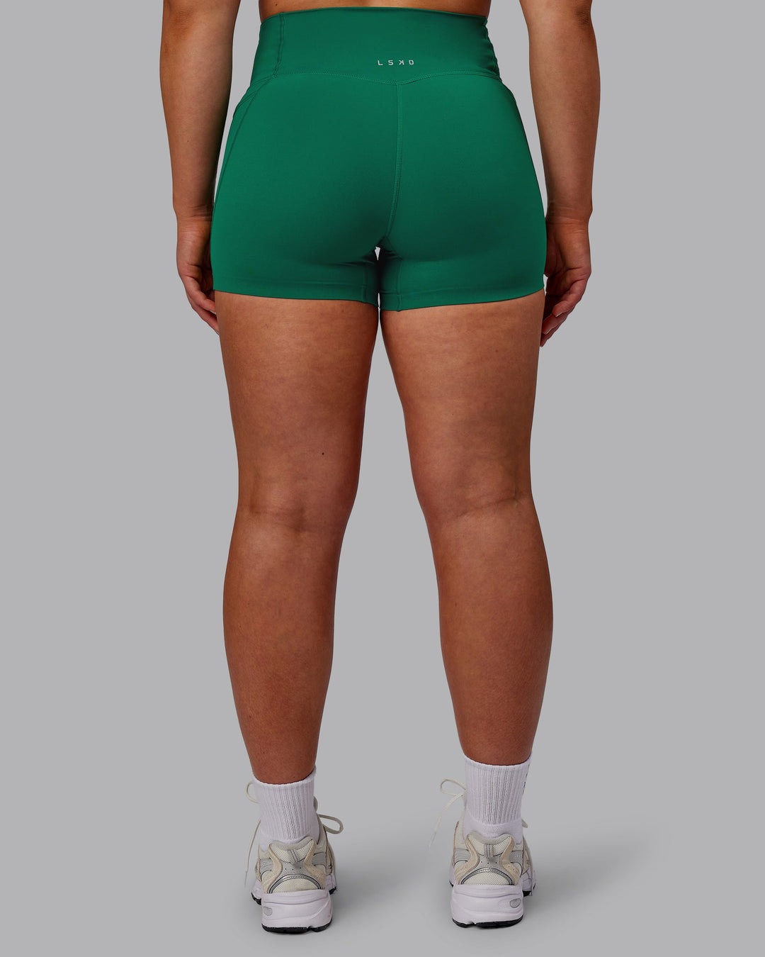 Woman wearing Elixir Ultra High-Rise 4" Short Pockets - Malachite