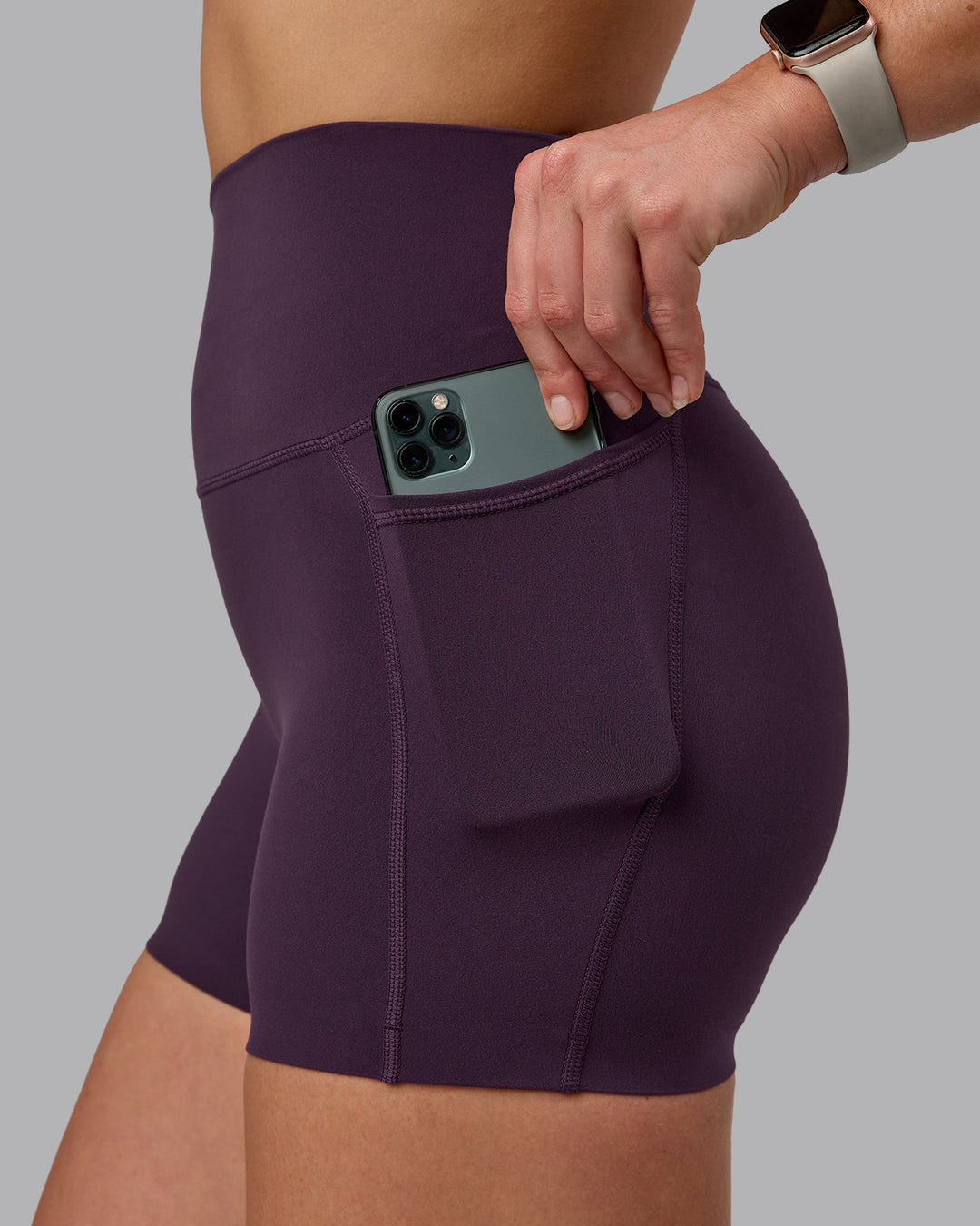 Woman wearing Elixir Ultra High-Rise 4" Short Pockets - Midnight Plum