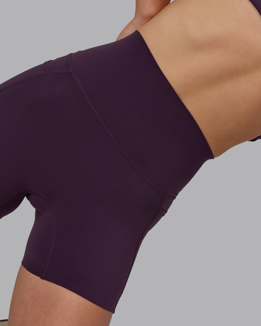 Woman wearing Elixir Ultra High-Rise 4" Short Pockets - Midnight Plum