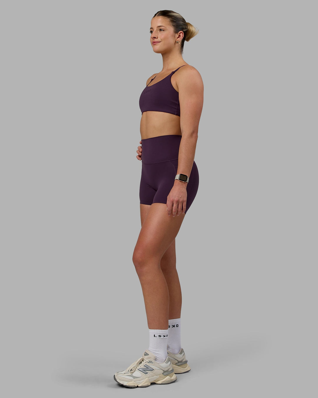 Woman wearing Elixir Ultra High-Rise 4" Short Pockets - Midnight Plum