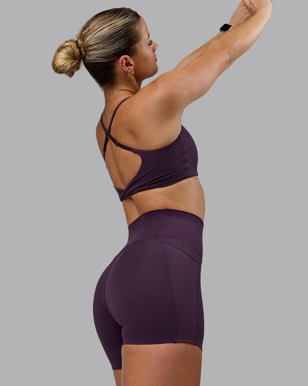 Woman wearing Elixir Ultra High-Rise 4" Short Pockets - Midnight Plum