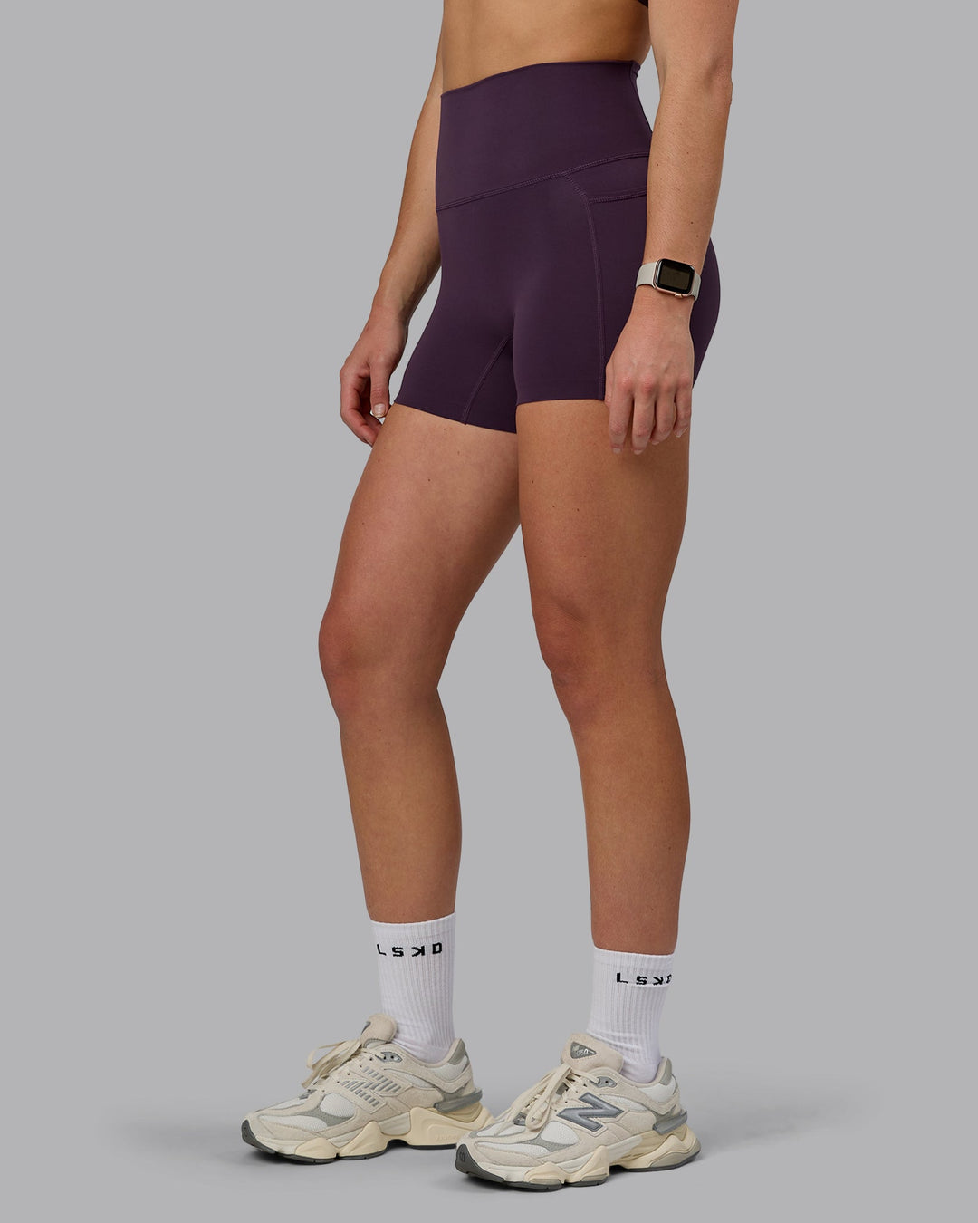Woman wearing Elixir Ultra High-Rise 4" Short Pockets - Midnight Plum