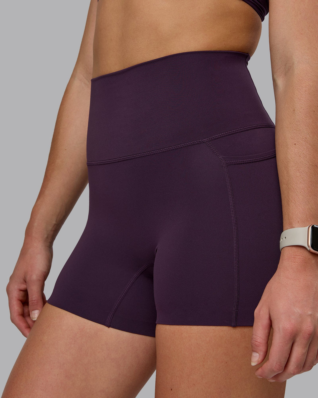Woman wearing Elixir Ultra High-Rise 4" Short Pockets - Midnight Plum