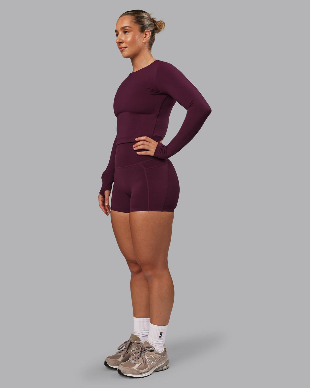 Woman wearing Elixir Ultra High-Rise 4" Short Pockets - Cherry Lacquer