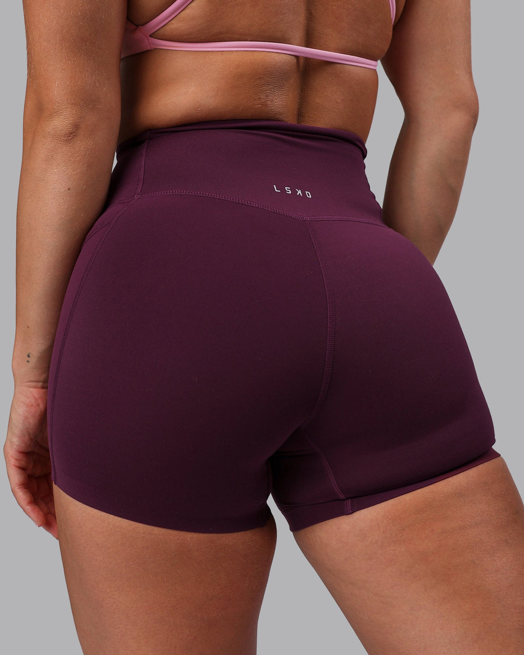 Woman wearing Elixir Ultra High-Rise 4" Short Pockets - Cherry Lacquer