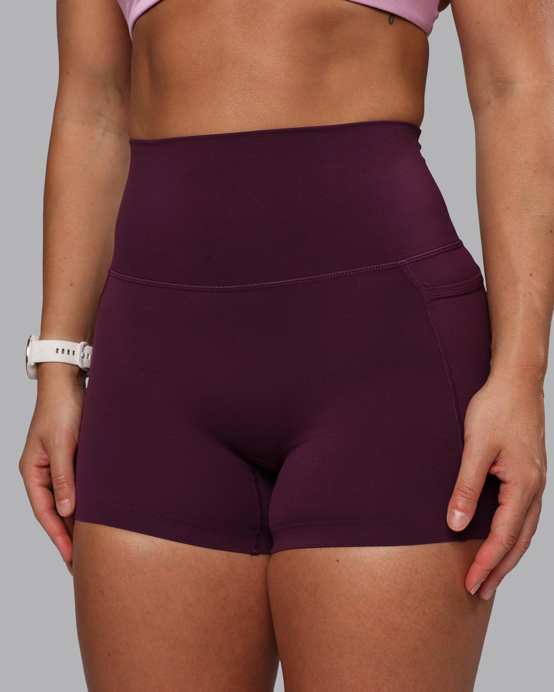 Woman wearing Elixir Ultra High-Rise 4" Short Pockets - Cherry Lacquer
