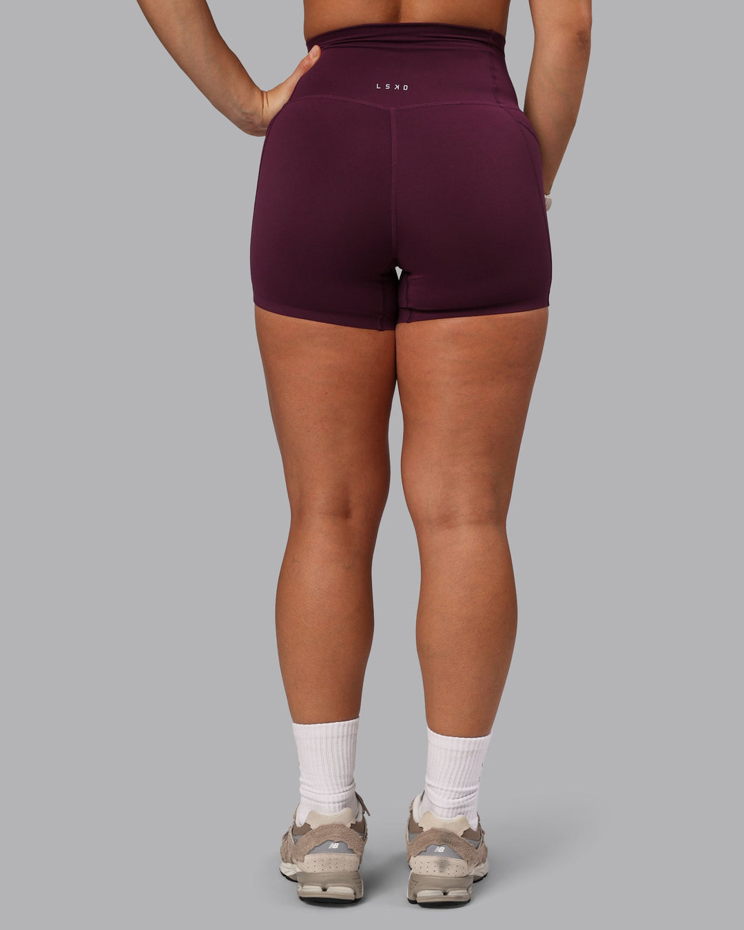 Woman wearing Elixir Ultra High-Rise 4" Short Pockets - Cherry Lacquer