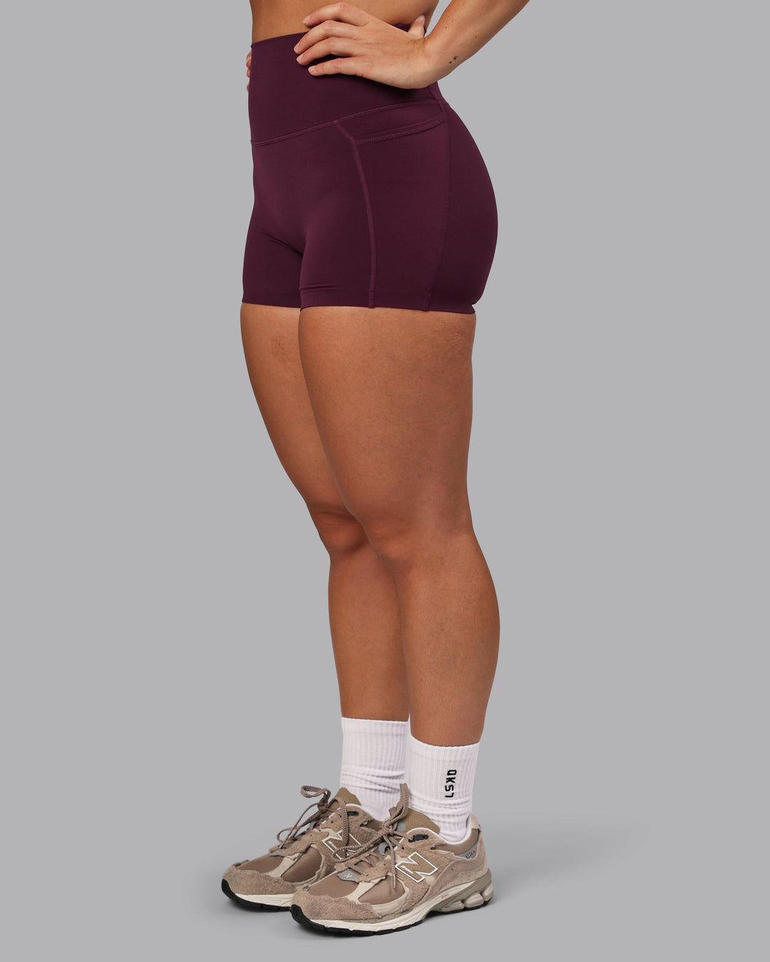 Woman wearing Elixir Ultra High-Rise 4" Short Pockets - Cherry Lacquer