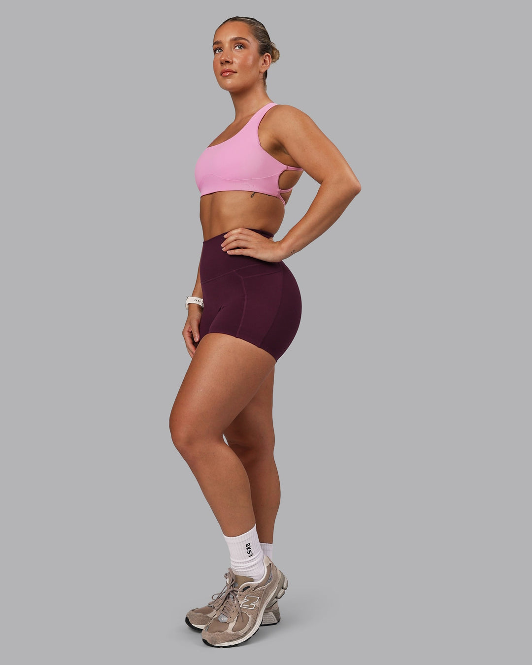 Woman wearing Elixir Ultra High-Rise 4" Short Pockets - Cherry Lacquer