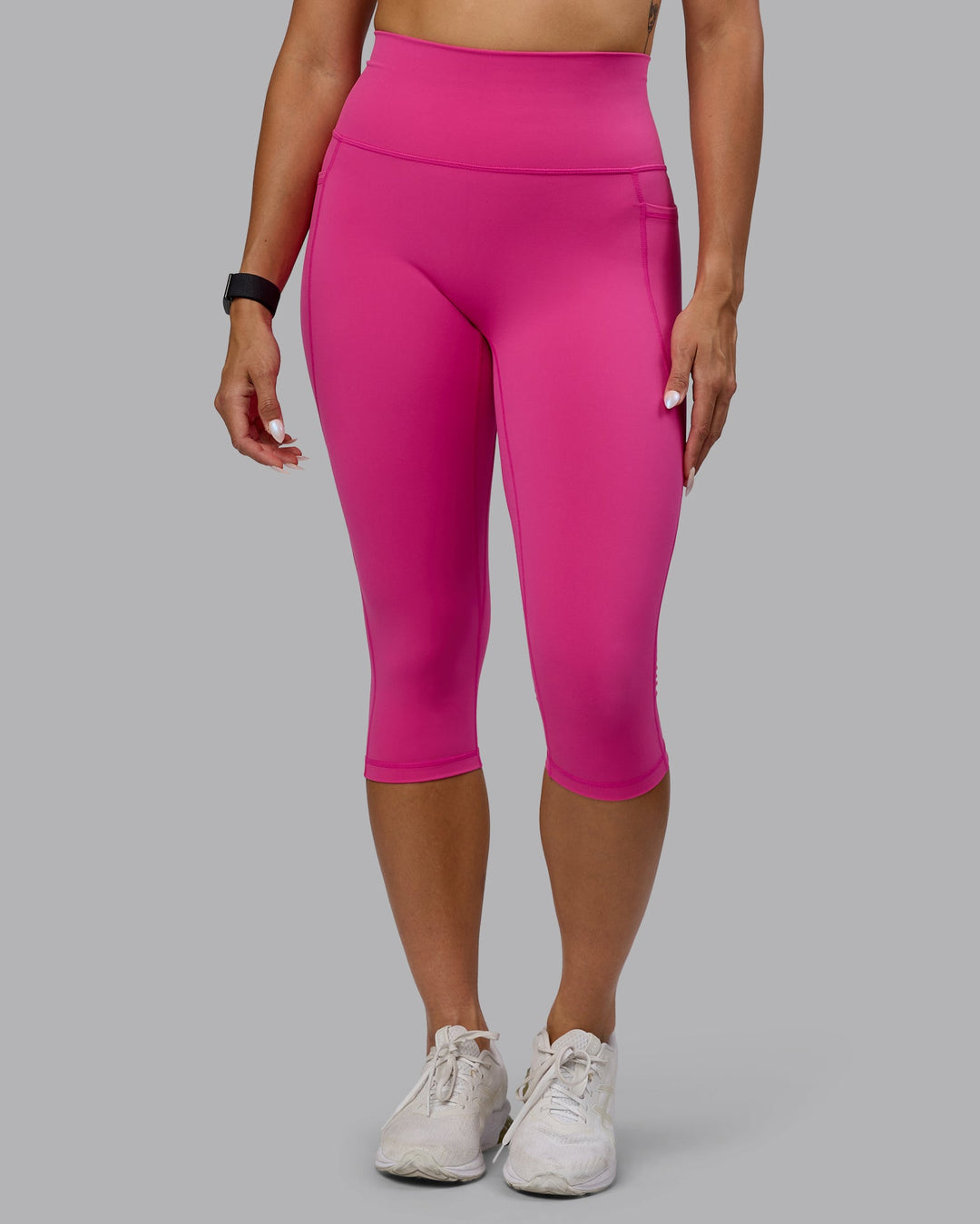 Woman wearing Fusion Ultra High-Rise 3/4 Legging Pockets - Fuchsia Pink | Model:Vanessa | Size:S