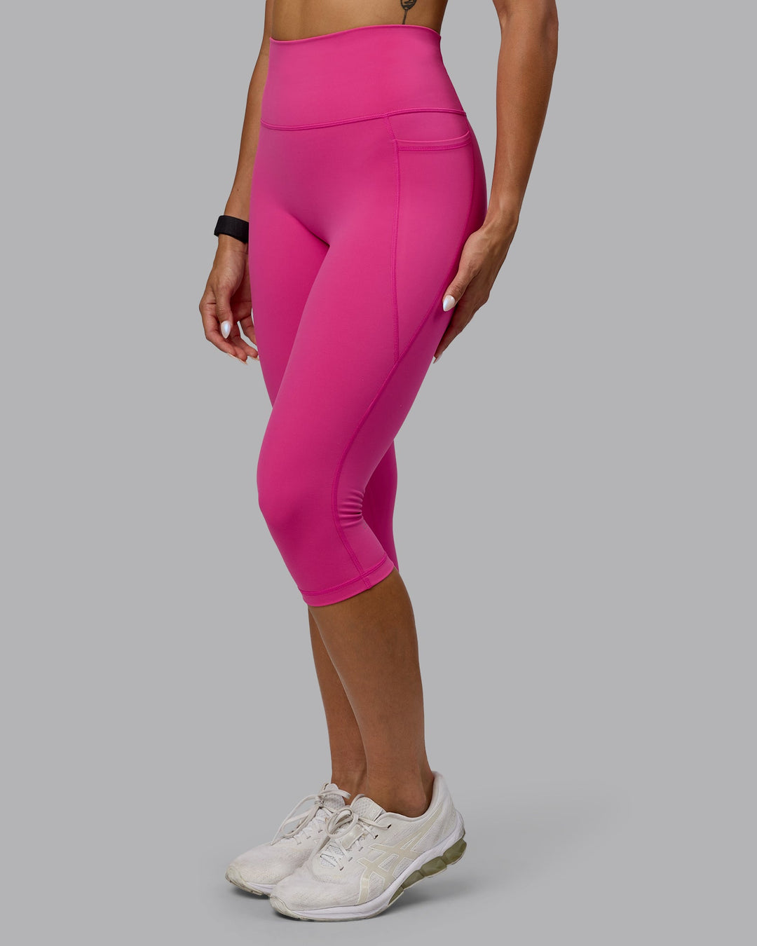 Woman wearing Fusion Ultra High-Rise 3/4 Legging Pockets - Fuchsia Pink | Model:Vanessa | Size:S