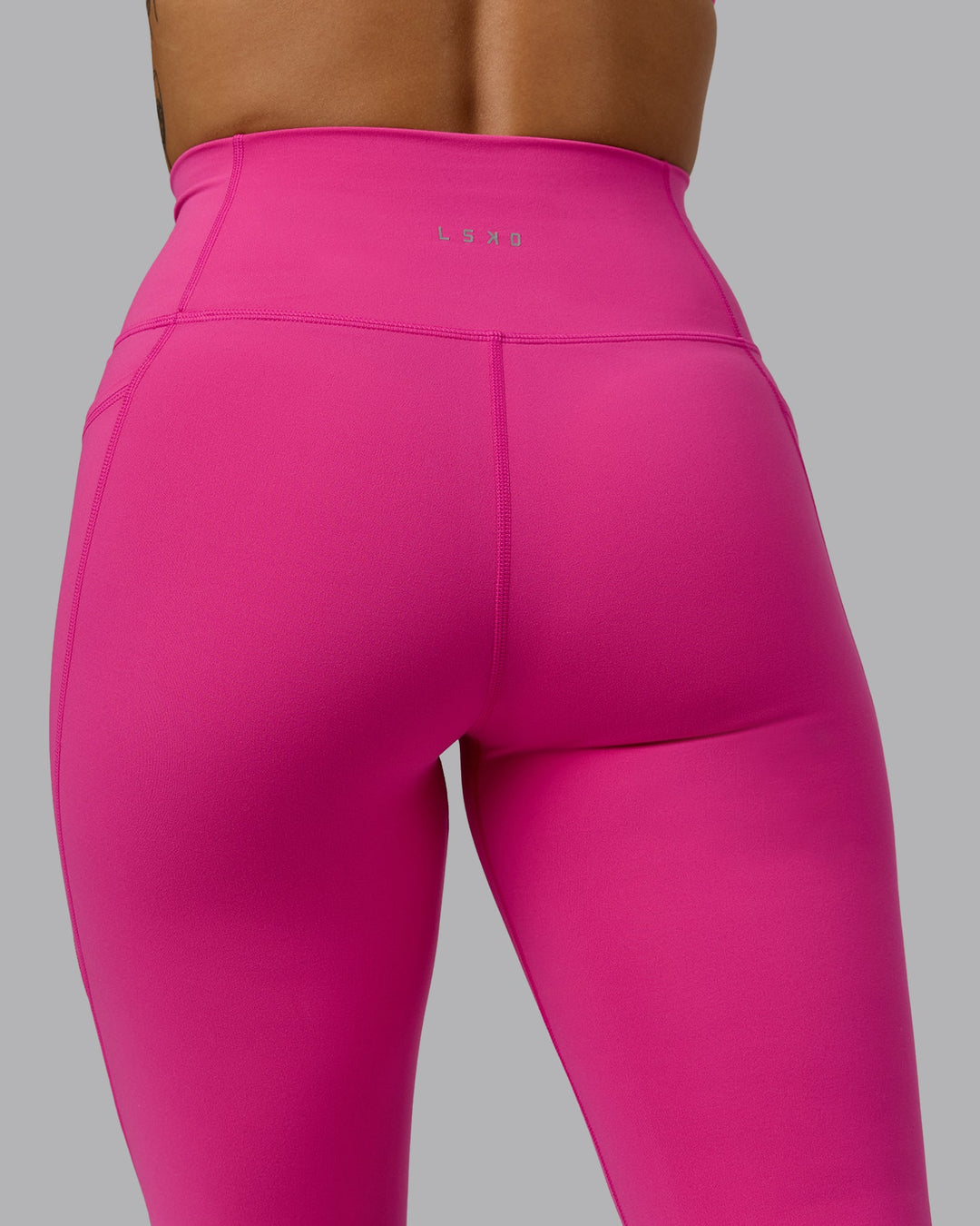 Woman wearing Fusion Ultra High-Rise 3/4 Legging Pockets - Fuchsia Pink | Model:Vanessa | Size:S