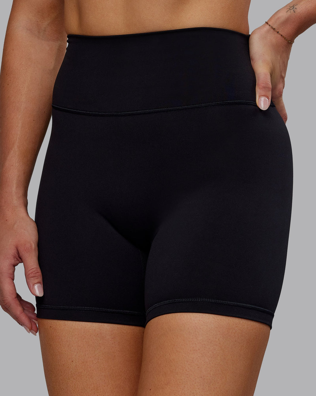 Woman wearing Fusion Ultra High-Rise 6" Short - Black | Model:Hannah | Size:S